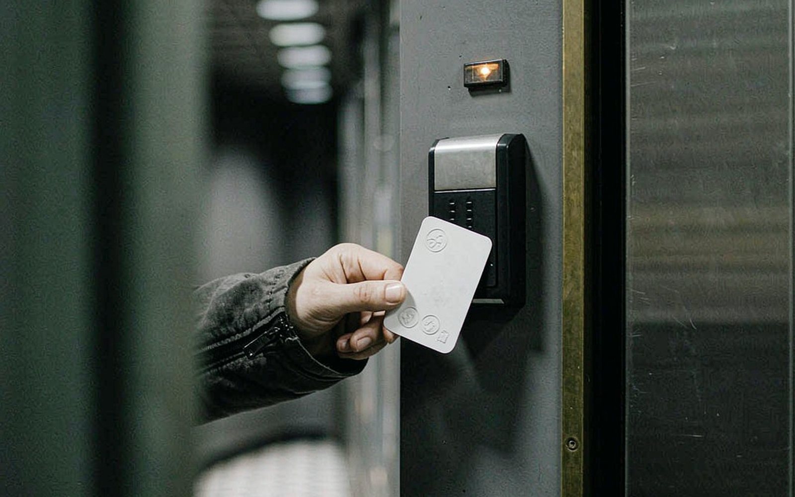 Access card presented to a reader at a secure door