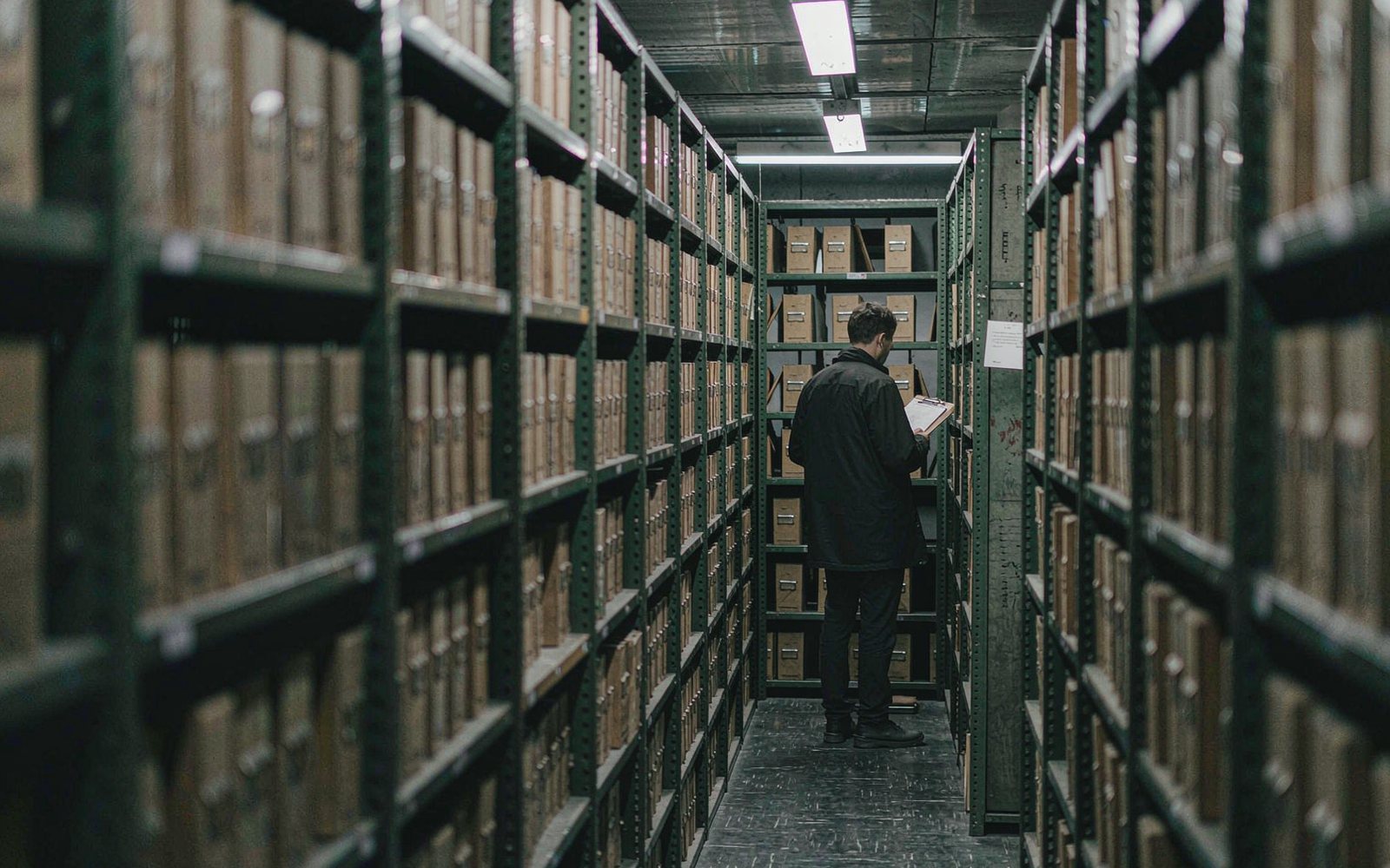 Records room patrol between mobile document shelving