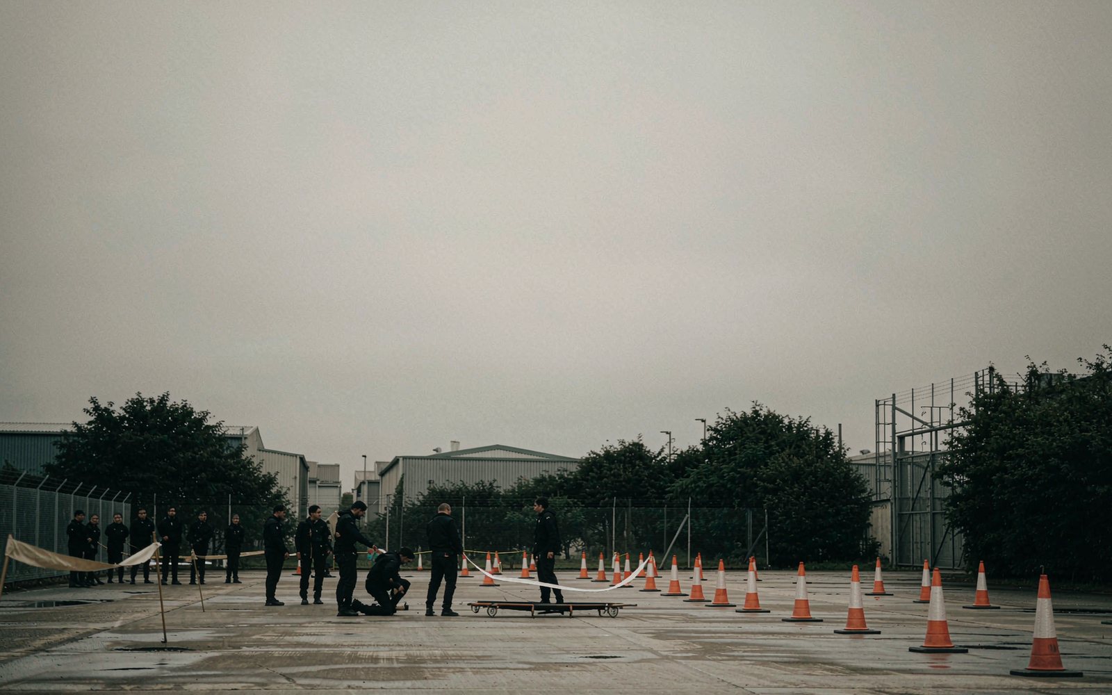 Outdoor training yard laid out with cones and barrier tape